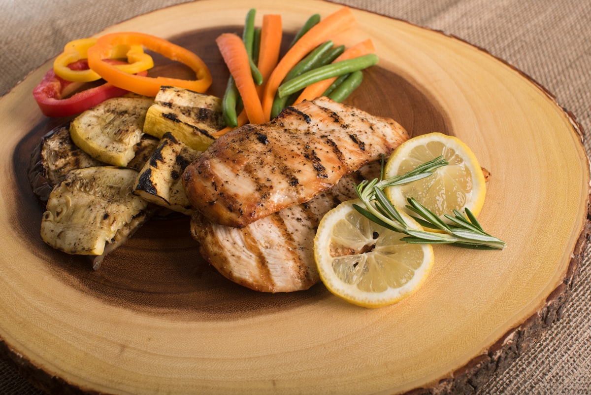 High-protein foods including grilled chicken, eggs, and legumes